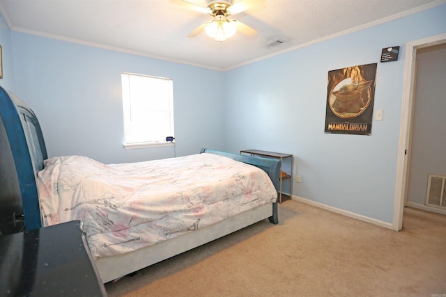 bedroom featuring baseboards, ornamental molding, visible vents, and light colored carpet