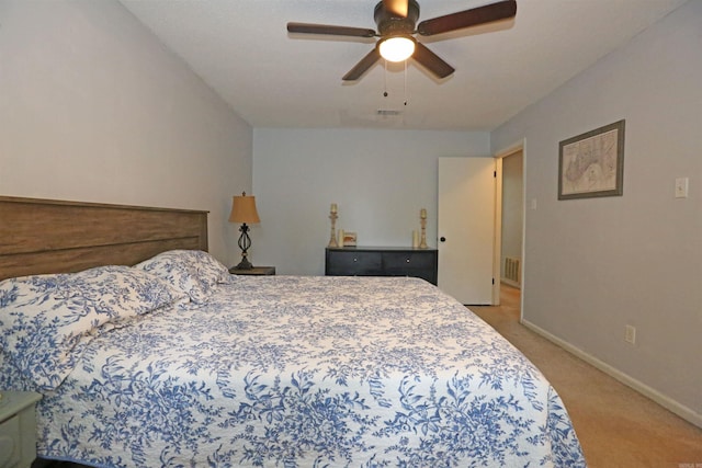 bedroom featuring visible vents, ceiling fan, light carpet, and baseboards