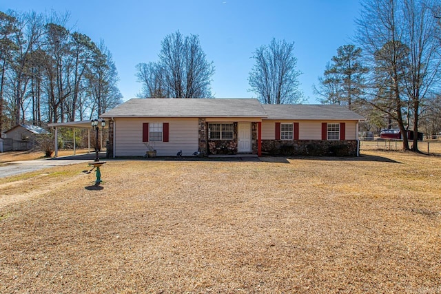 single story home with a carport and a front yard