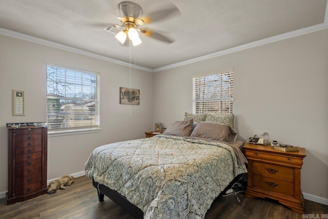 bedroom with dark wood-style floors, crown molding, baseboards, and ceiling fan