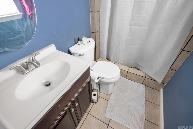 bathroom featuring toilet, tile patterned flooring, and vanity