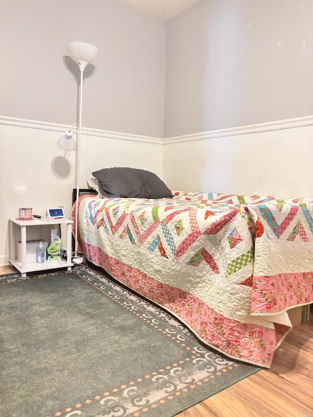 bedroom with wood finished floors