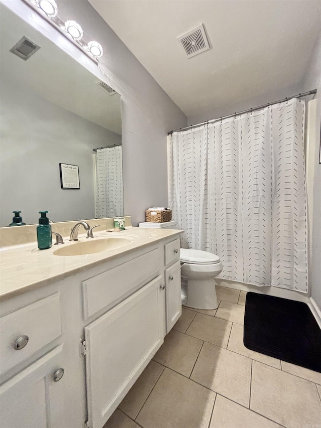 full bathroom with vanity, tile patterned flooring, and visible vents