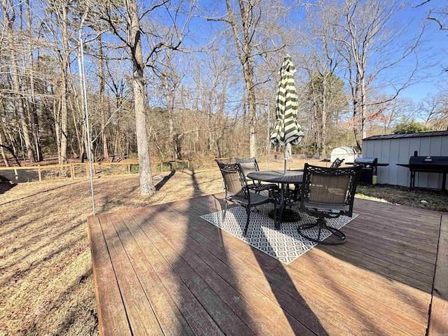 wooden deck with outdoor dining space