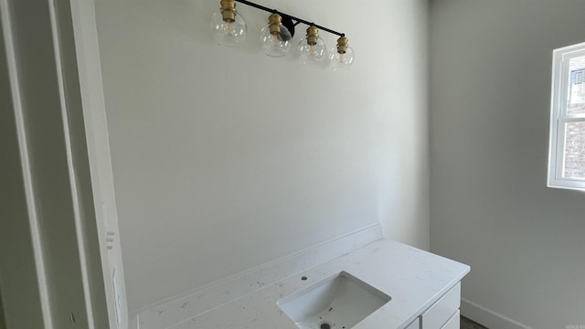 8 Dandelion, Greenbrier, AR 72058 - bathroom with baseboards and a sink