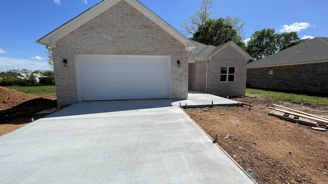 8 Dandelion, Greenbrier, AR 72058 - single story home with brick siding, driveway, and an attached garage