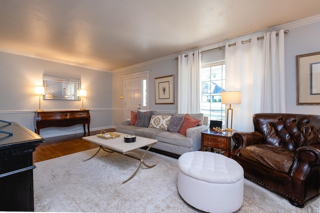 living room with baseboards, ornamental molding, and wood finished floors