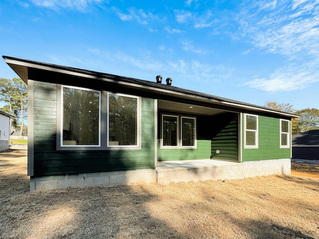 rear view of house featuring a patio area