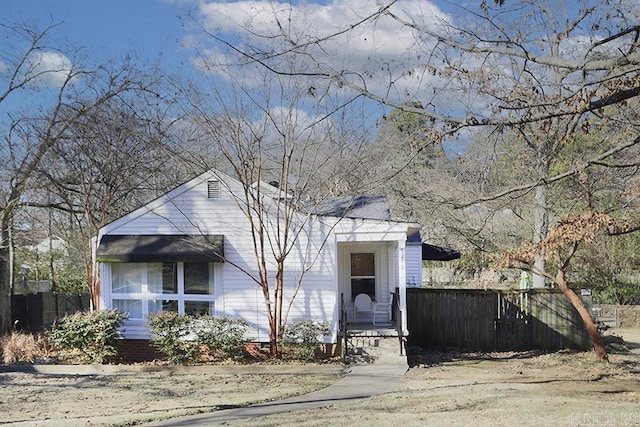 view of front of house featuring fence