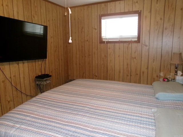 bedroom with wooden walls