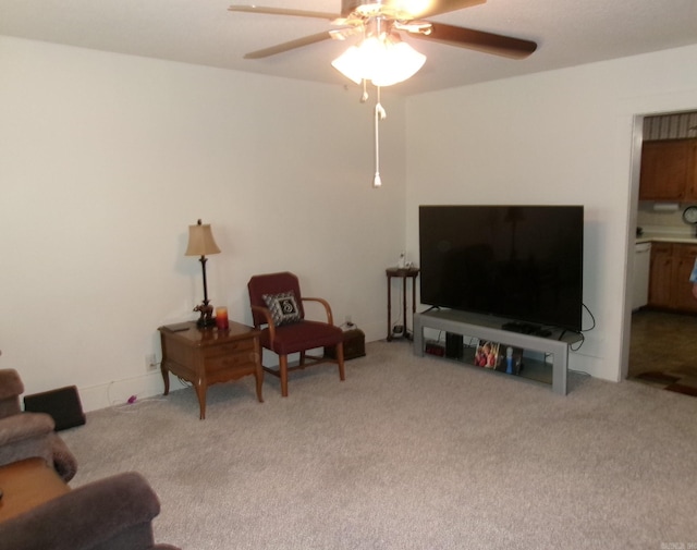 living room with a ceiling fan and light colored carpet