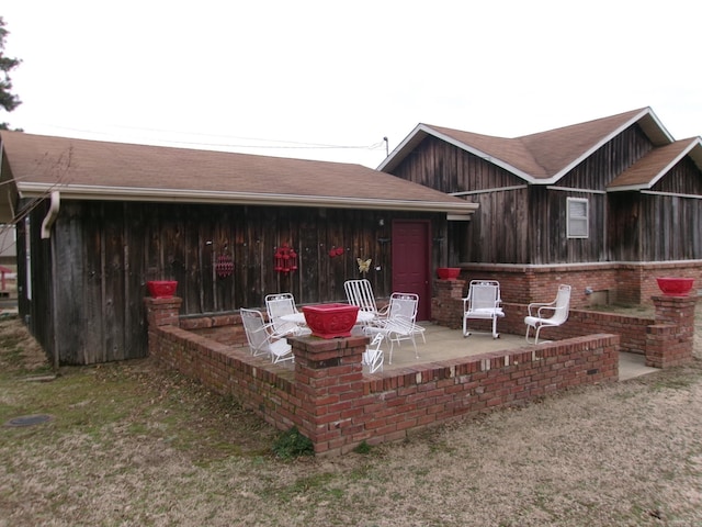 rear view of property featuring a patio