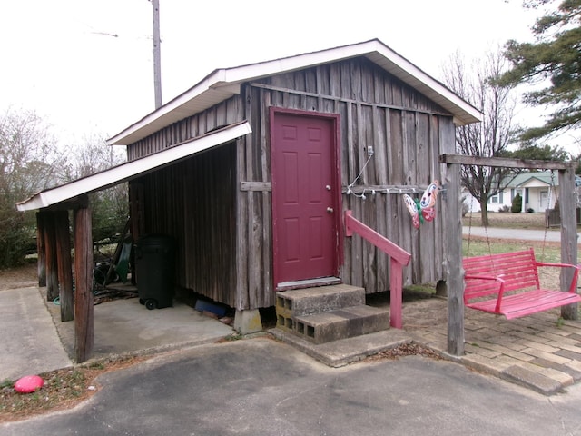 view of outbuilding with entry steps and an outbuilding