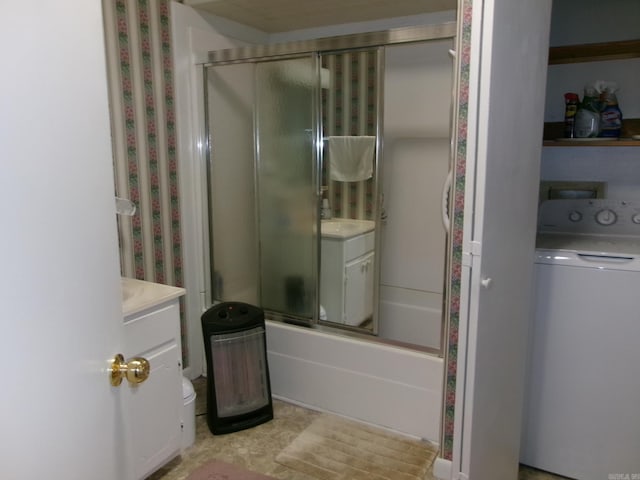 full bath with washer / clothes dryer, combined bath / shower with glass door, and vanity