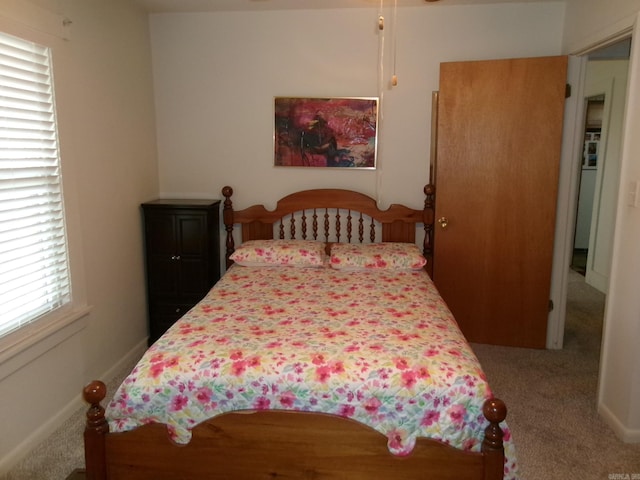 carpeted bedroom with baseboards