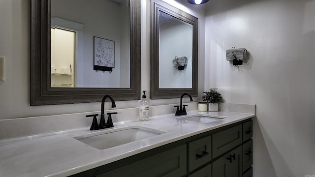 bathroom with a sink and double vanity