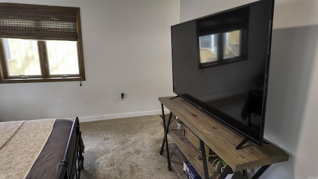 unfurnished bedroom with carpet floors and baseboards