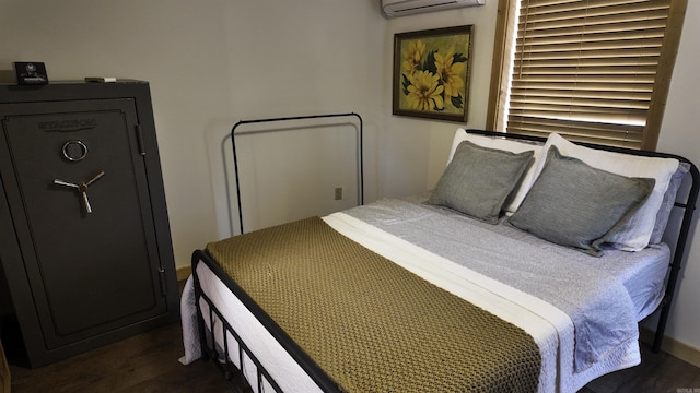 bedroom featuring a wall mounted air conditioner