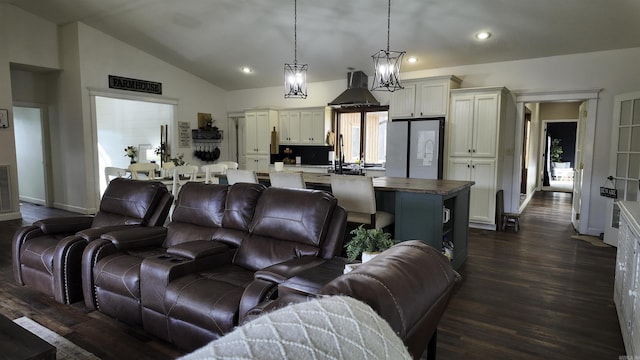 living area with dark wood-style floors, lofted ceiling, baseboards, and recessed lighting