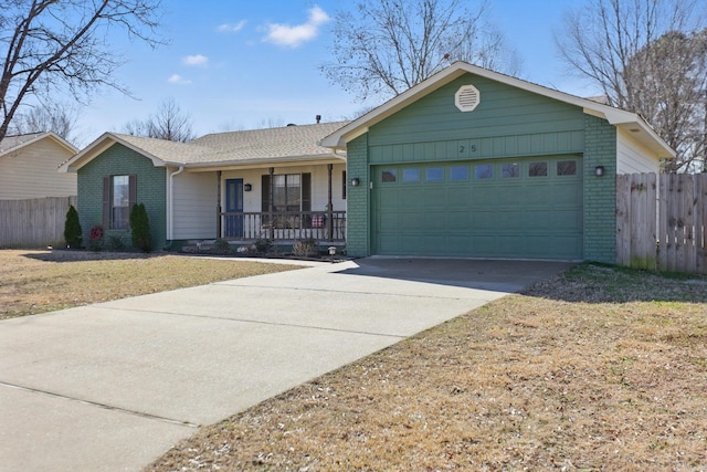 single story home with covered porch, brick siding, and an attached garage