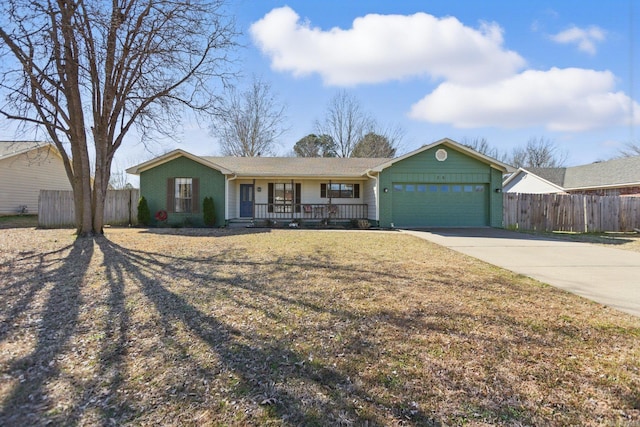 ranch-style house with brick siding, covered porch, concrete driveway, an attached garage, and fence