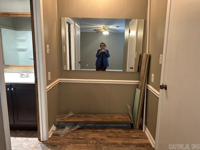 interior space featuring a sink and wood finished floors