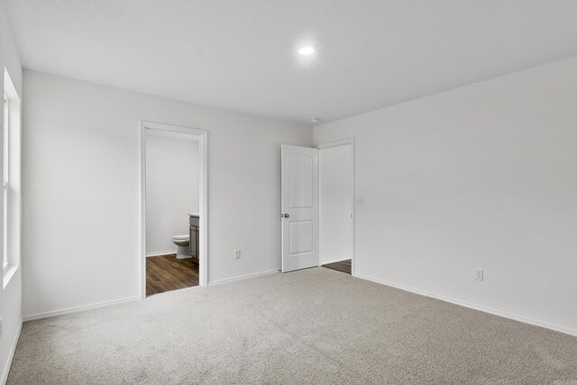 25 Ten Point Ln, Ward, AR 72176 - unfurnished bedroom with carpet floors, baseboards, and ensuite bathroom