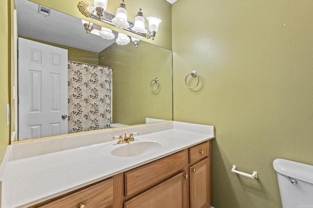 full bathroom with visible vents, vanity, and toilet