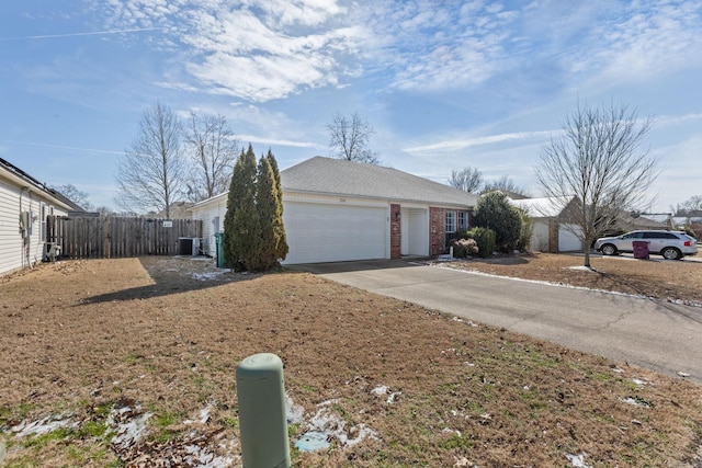 view of front of home with central AC unit, a garage, brick siding, fence, and driveway