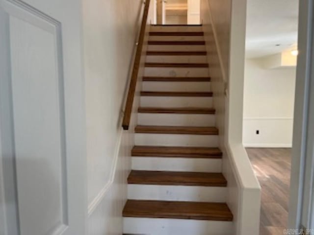 stairs with wood finished floors