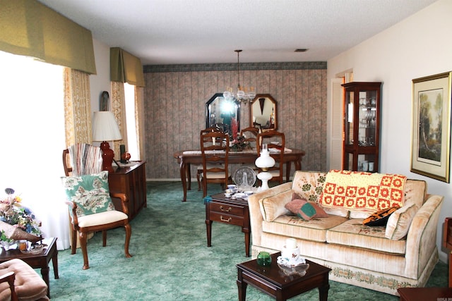 carpeted living area with a chandelier and visible vents