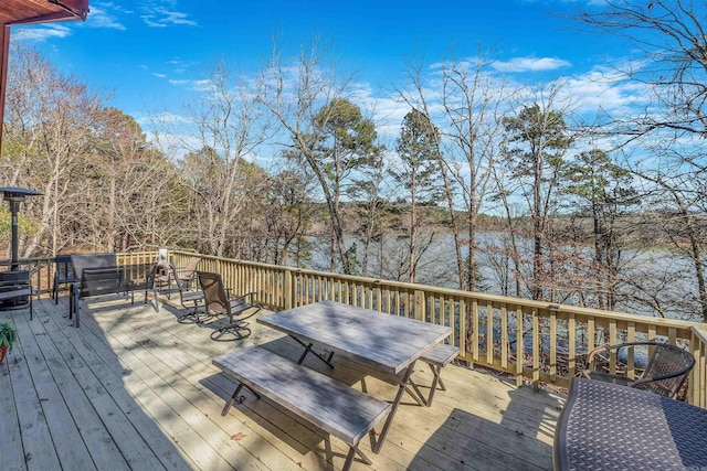 wooden terrace featuring outdoor dining area