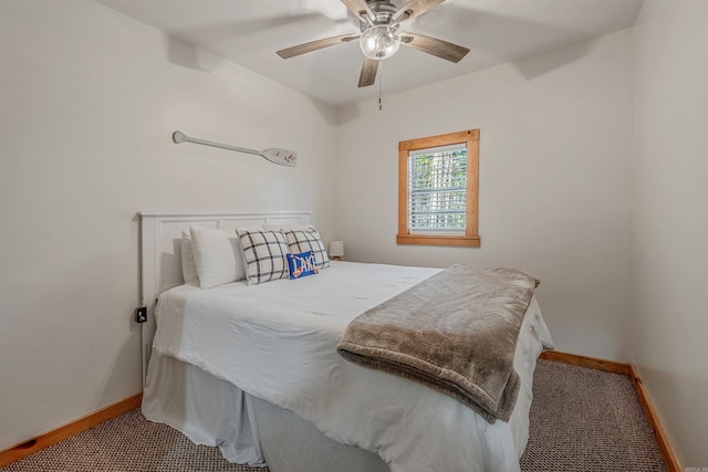 bedroom with ceiling fan and baseboards