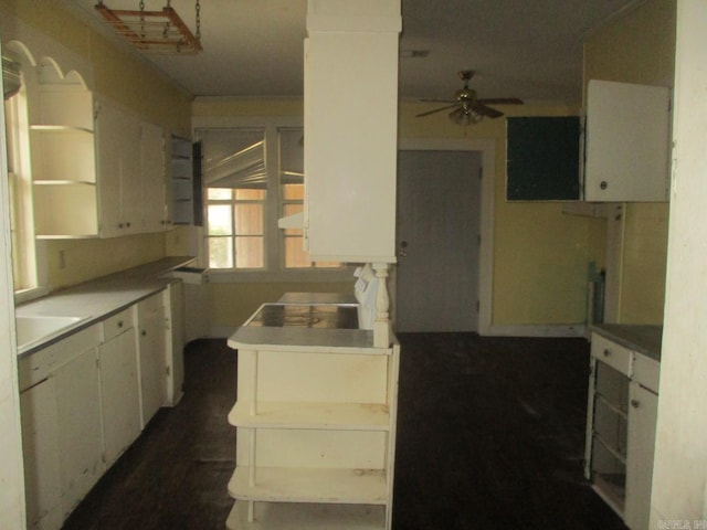 kitchen featuring ceiling fan, white cabinetry, open shelves, and a sink