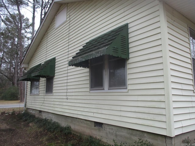 view of property exterior featuring crawl space