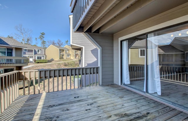 wooden terrace with a residential view