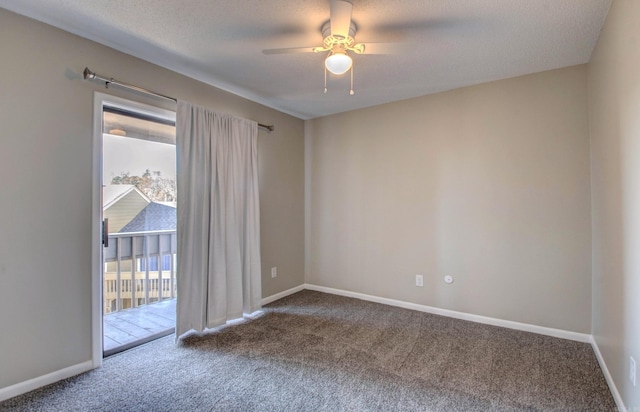 empty room featuring plenty of natural light, a textured ceiling, baseboards, and carpet flooring