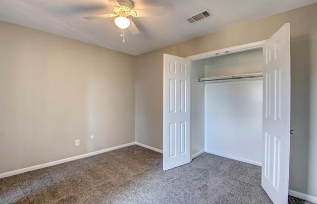 unfurnished bedroom with carpet floors, visible vents, and baseboards