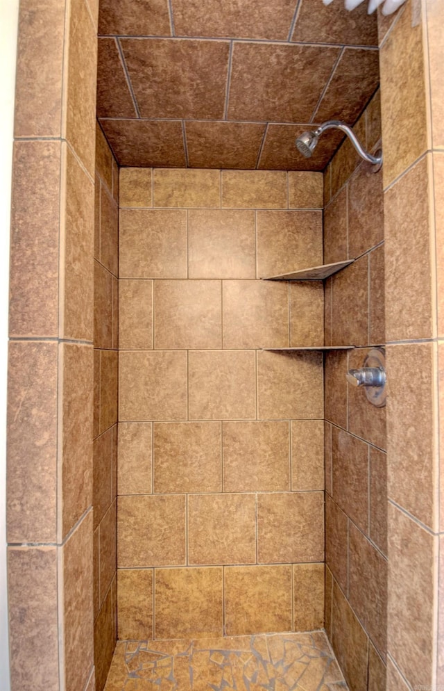 details with a tile shower