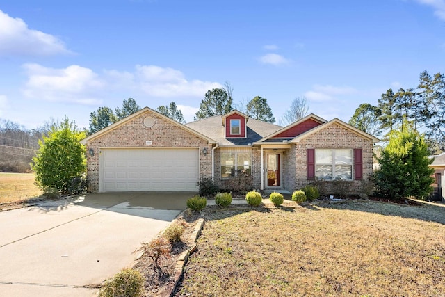 view of front of property featuring brick siding, driveway, and an attached garage