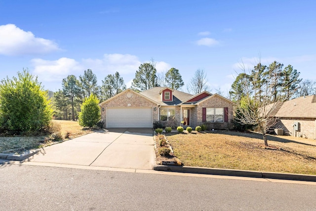 view of front of property featuring an attached garage, concrete driveway, and brick siding