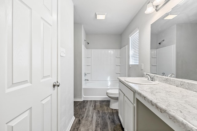 full bath with bathing tub / shower combination, visible vents, toilet, vanity, and wood finished floors