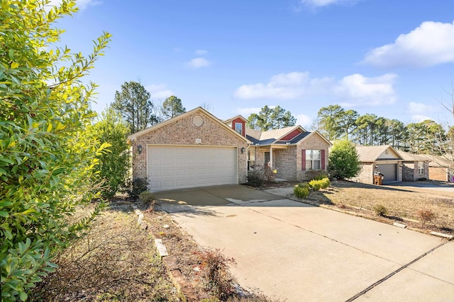 ranch-style home with a garage, driveway, and brick siding