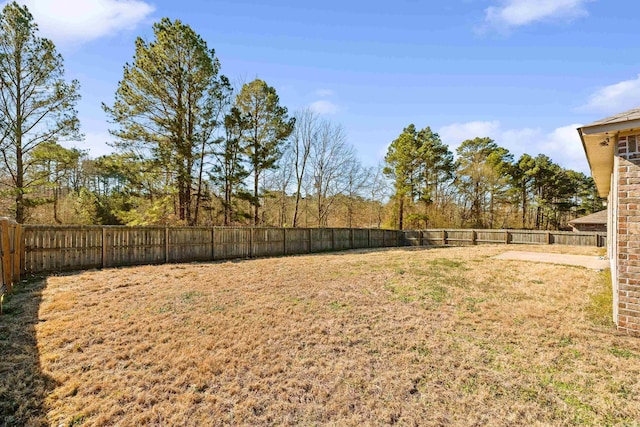 view of yard with a fenced backyard