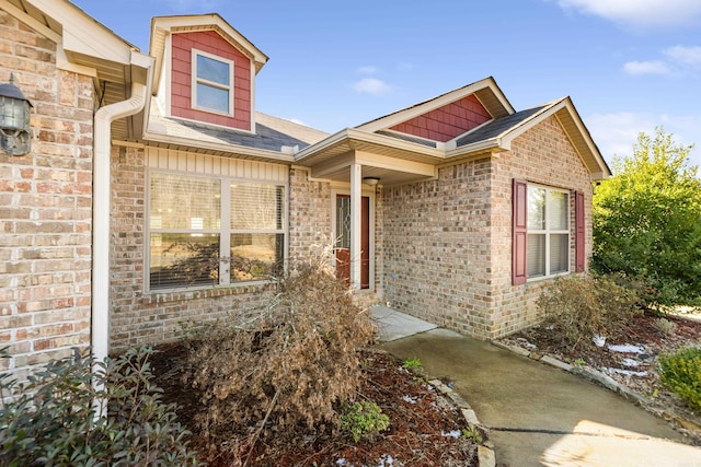 view of front of home featuring brick siding