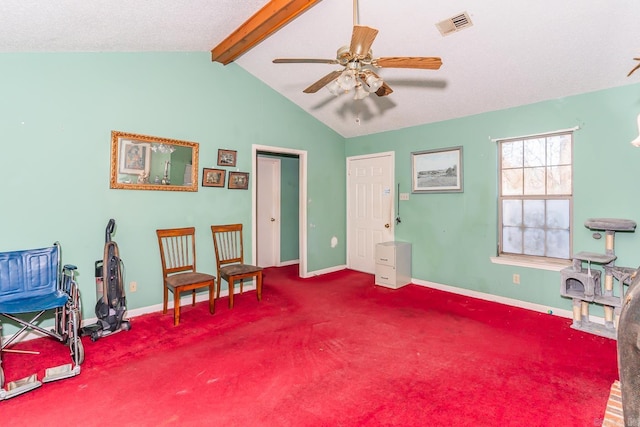 sitting room with vaulted ceiling with beams, ceiling fan, carpet flooring, and baseboards