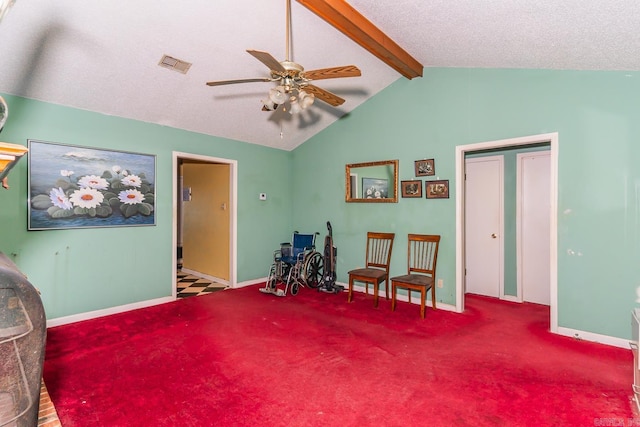 living area with lofted ceiling with beams, a ceiling fan, visible vents, and carpet flooring