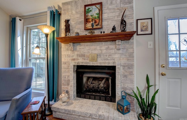 interior space featuring a brick fireplace and a healthy amount of sunlight