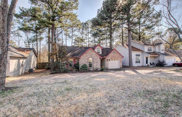 view of front of home with fence, a front lawn, and central air condition unit