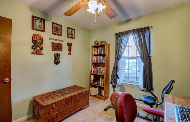 office featuring light carpet, a textured ceiling, a ceiling fan, and a wealth of natural light